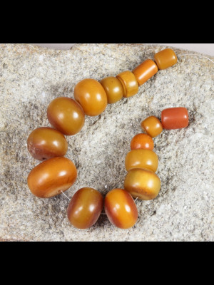 11 African amber beads (phenolic resin)