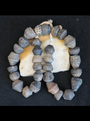 30 old terracotta spindle whorls