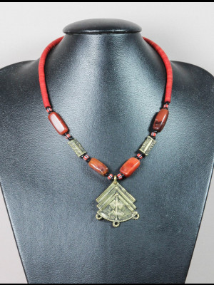 Necklace with bakelite heishi trade beads (koffi beads), carnelian and brass beads, a pendant in brass