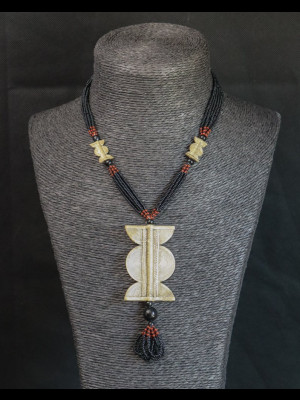 Necklace with a brass pendant
