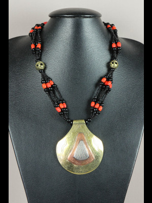 Necklace with glass and brass beads and a brass pendant with copper and silvered metal
