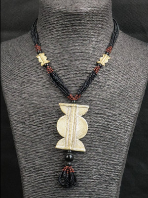 Necklace with brass beads and a brass pendant