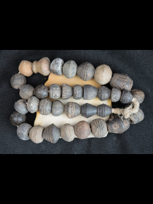 34 antique terracotta spindle whorls
