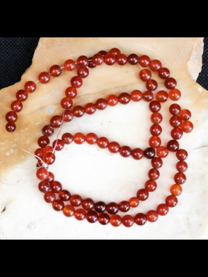 Strand of 95 round carnelian beads