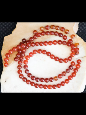 Strand of 98 round carnelian beads
