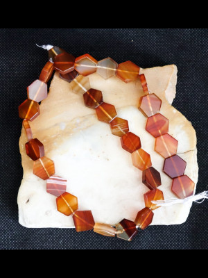 Strand of 32 hexagonal carnelian beads