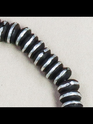 100 beads of black wood circled with silvered metal