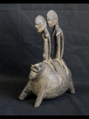 Dogon couple riding an animal (Mali)