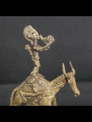 Dogon woman rideng a zebu (Bronze from Mali)