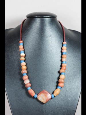 Necklace with red calcite beads, a carnelian bead and glass trade beads
