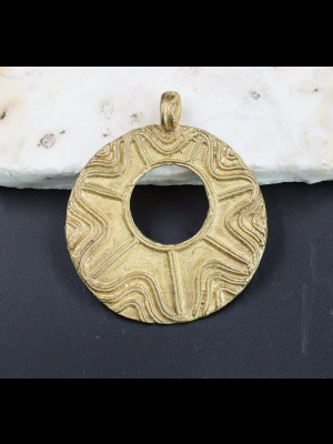 Pendant in brass