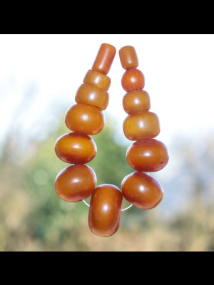 13 African amber beads (phenolic resin)