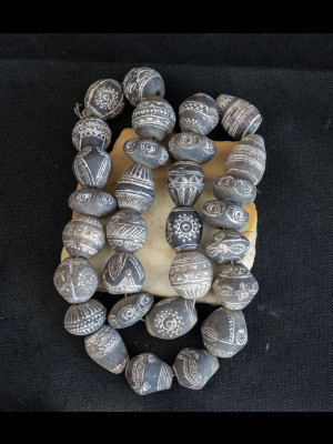 30 old terracotta spindle whorls