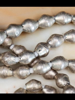 Strand of 100 beads in silvered metal