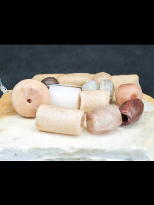 Strand of 14 antique or ancient stone beads